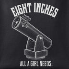 Close-up of the Eight Inches, All a Girl Needs print showing ink detail on black cotton fabric