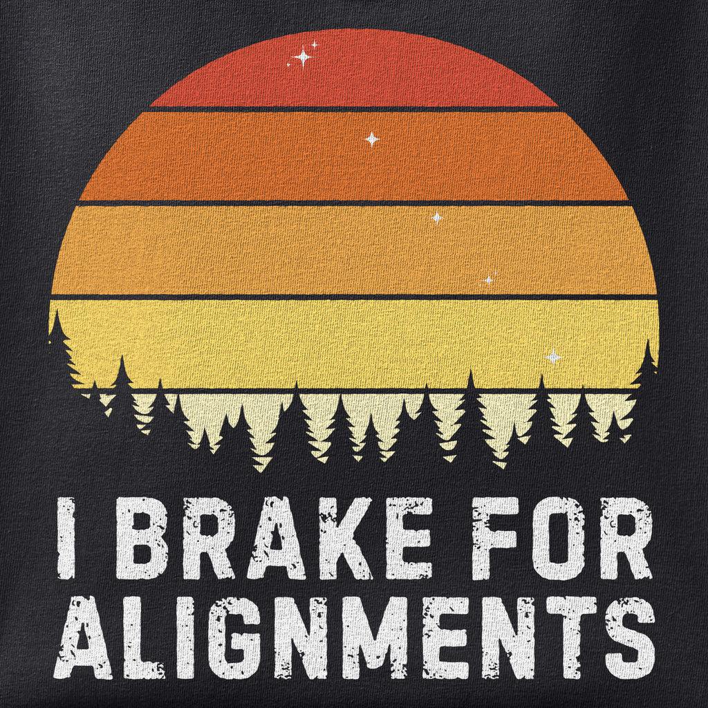 Close-up of the I Brake for Alignments print showing ink detail on black cotton fabric