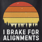 Close-up of the I Brake for Alignments print showing ink detail on black cotton fabric