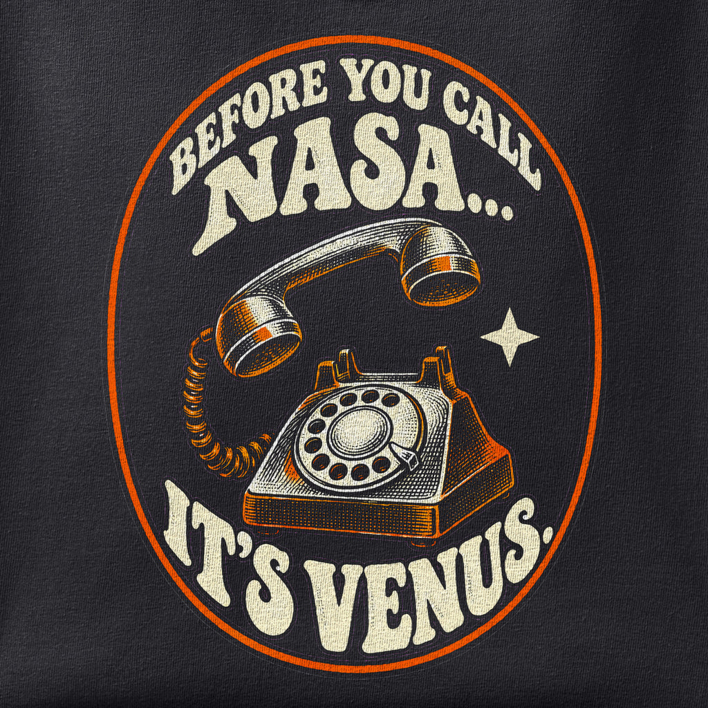 Close-up of the It's Venus print showing ink detail on black cotton fabric