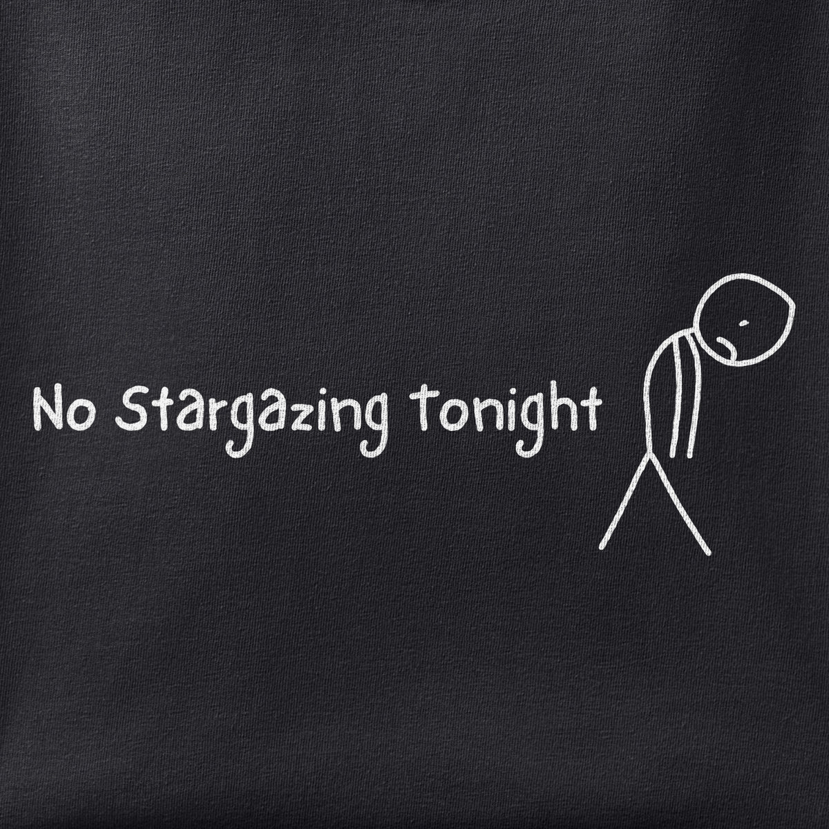 Close-up of the No Stargazing Tonight print showing ink detail on black cotton fabric