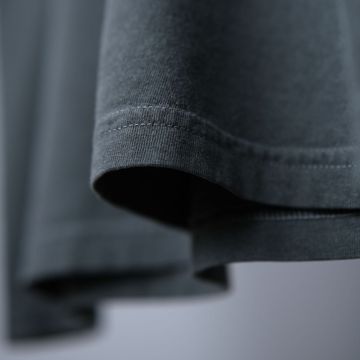Close-up of the sleeve hem drape showing the weight of the Comfort Colors 1717 cotton