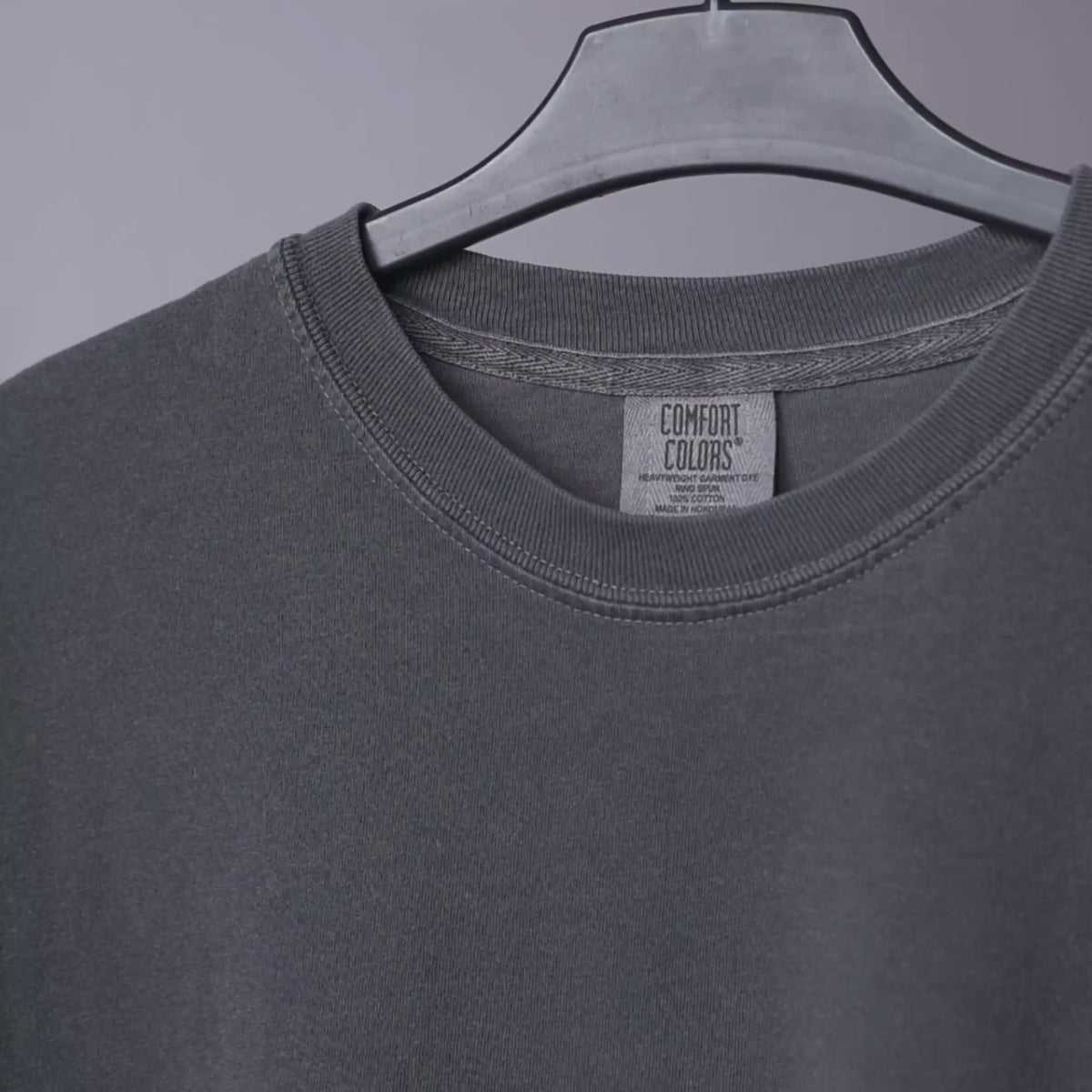 Comfort Colors 1717 tee in close-up: fabric weight, collar, neck label and hem stitching