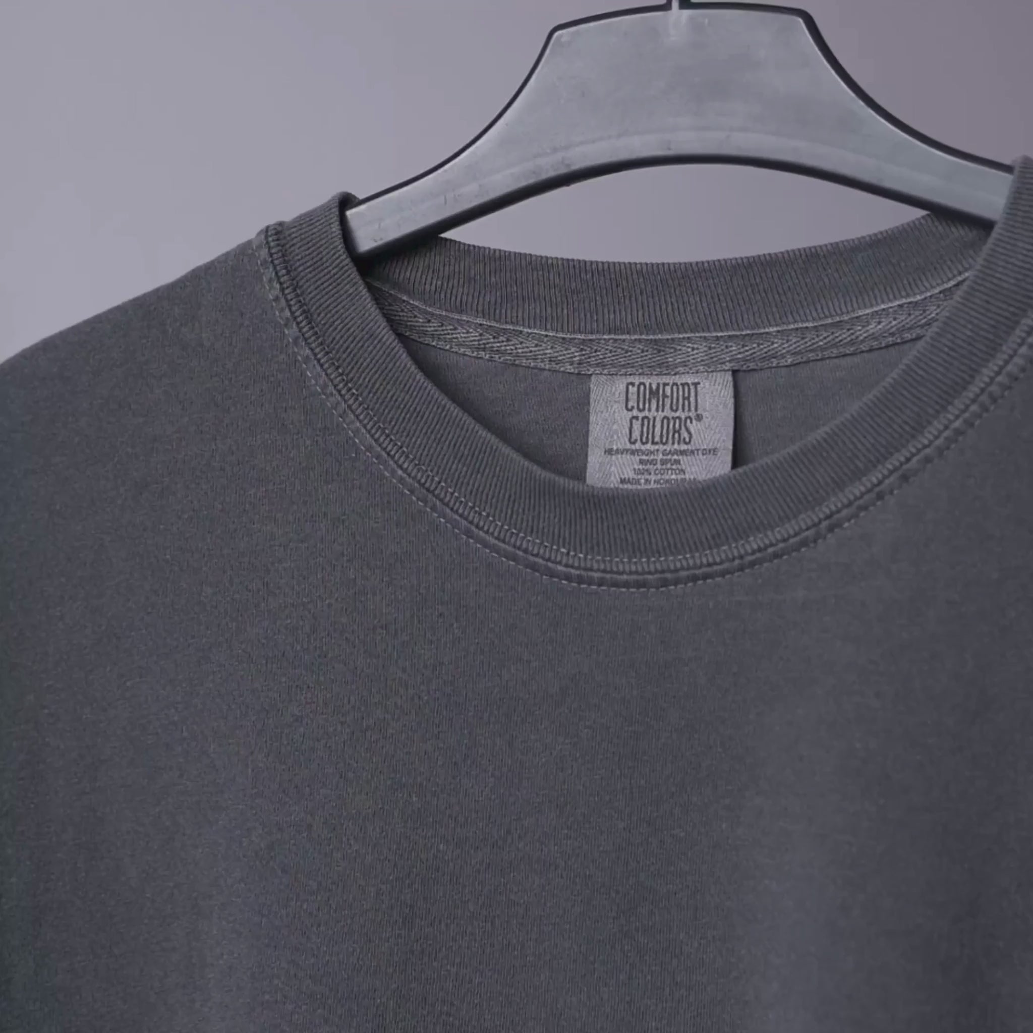 Comfort Colors 1717 tee in close-up: fabric weight, collar, neck label and hem stitching