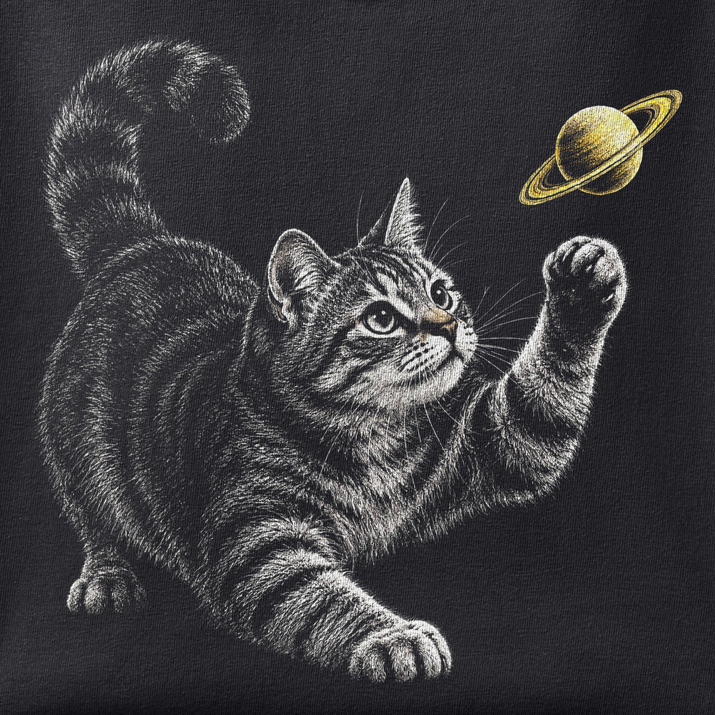 Close-up of the Saturn Cat print showing ink detail on black cotton fabric