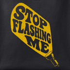 Close-up of the Stop Flashing Me print showing ink detail on black cotton fabric