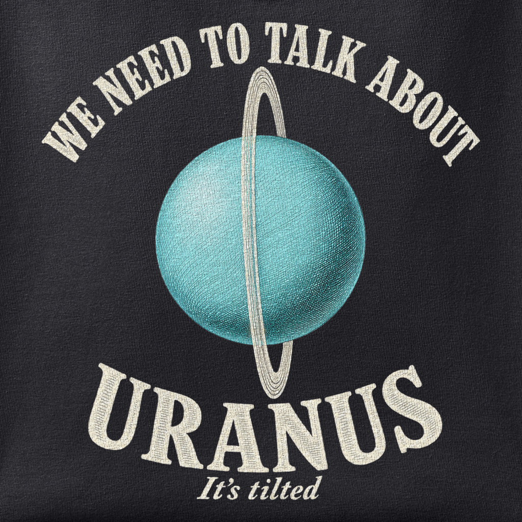 Close-up of the We Need to Talk about Uranus print showing ink detail on black cotton fabric