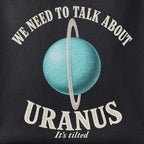 Close-up of the We Need to Talk about Uranus print showing ink detail on black cotton fabric