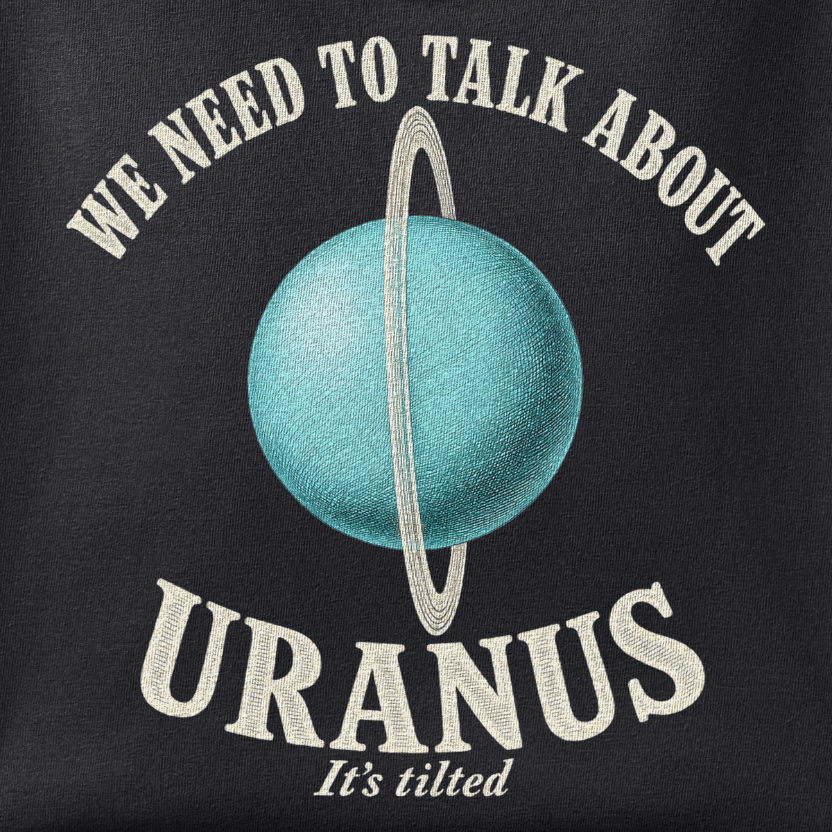 Close-up of the We Need to Talk about Uranus print showing ink detail on black cotton fabric