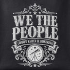 Close-up of the We the People print showing ink detail on black cotton fabric